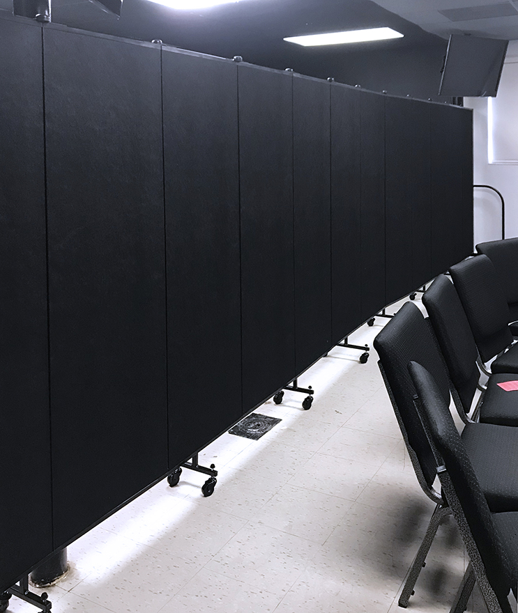 A closer look at an opened room partition separating an open classroom in two