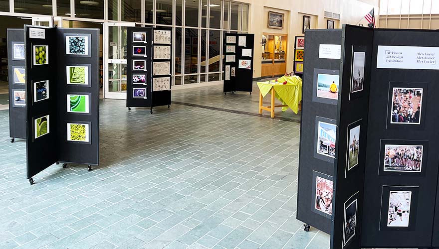 Student art on black display panels