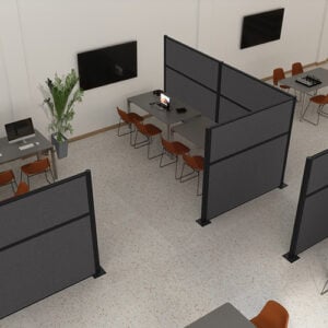Gray cubicles partially surrounding desks