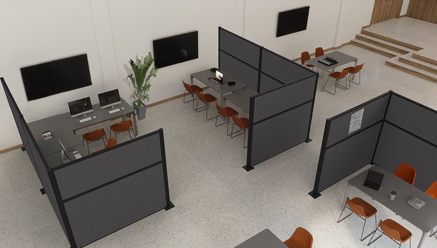 Gray cubicles partially surrounding desks