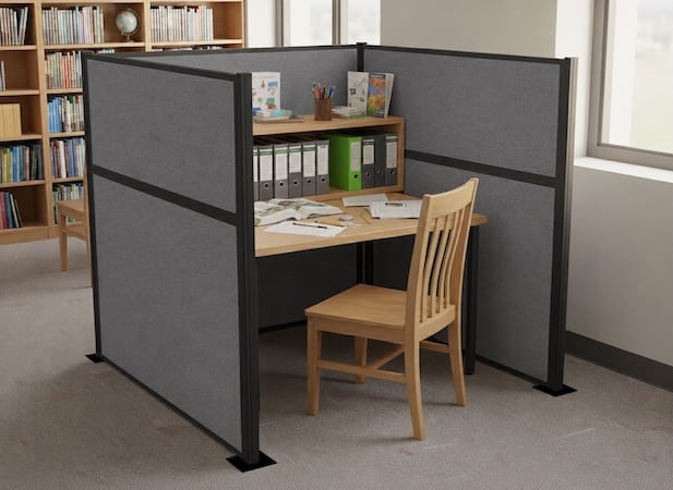Gray three-sided study pod creating a private workspace in a library